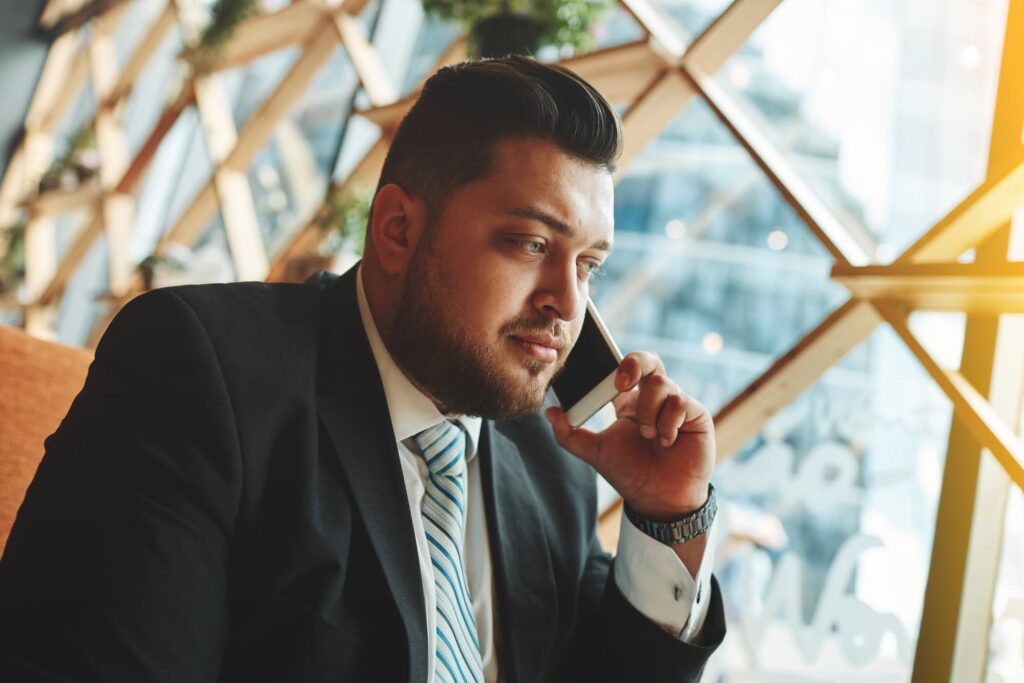 A man with his phone on his ear